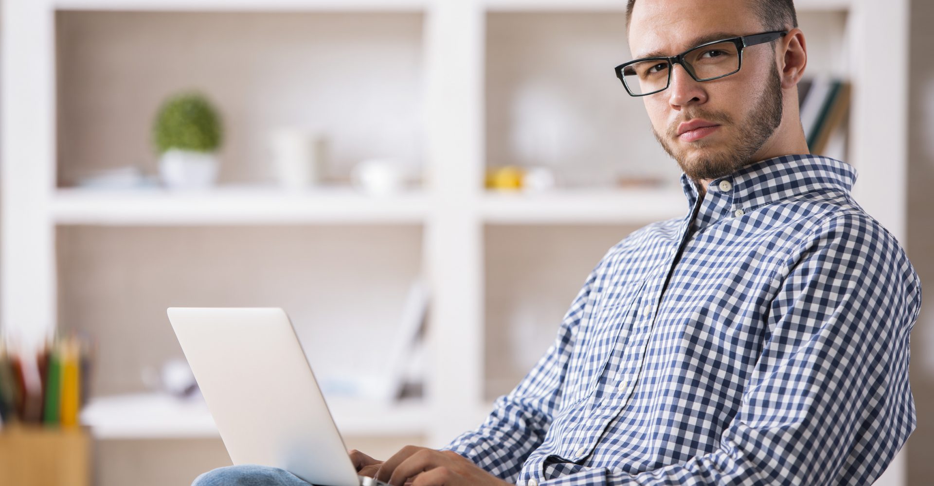 Caucasian male using laptop